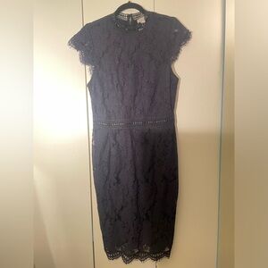 Navy blue lace Dress. H&M - Size Medium. new with tags. Mid length.